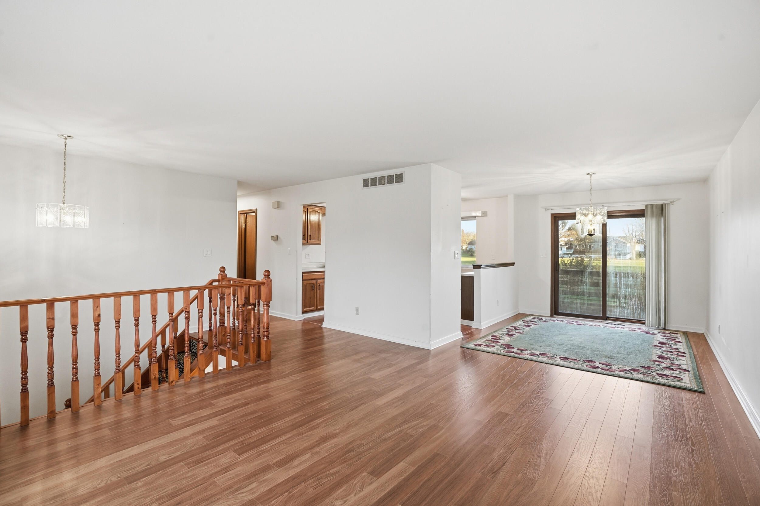 4142 Augusta Drive Crown Point, IN 46307 - Photo 3 of 24 a view of an empty room with wooden floor and a window