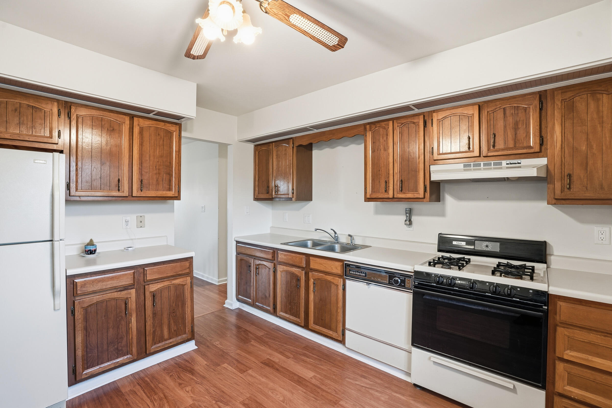 4142 Augusta Drive Crown Point, IN 46307 - Photo 5 of 24 a kitchen with stainless steel appliances a stove sink and cabinets