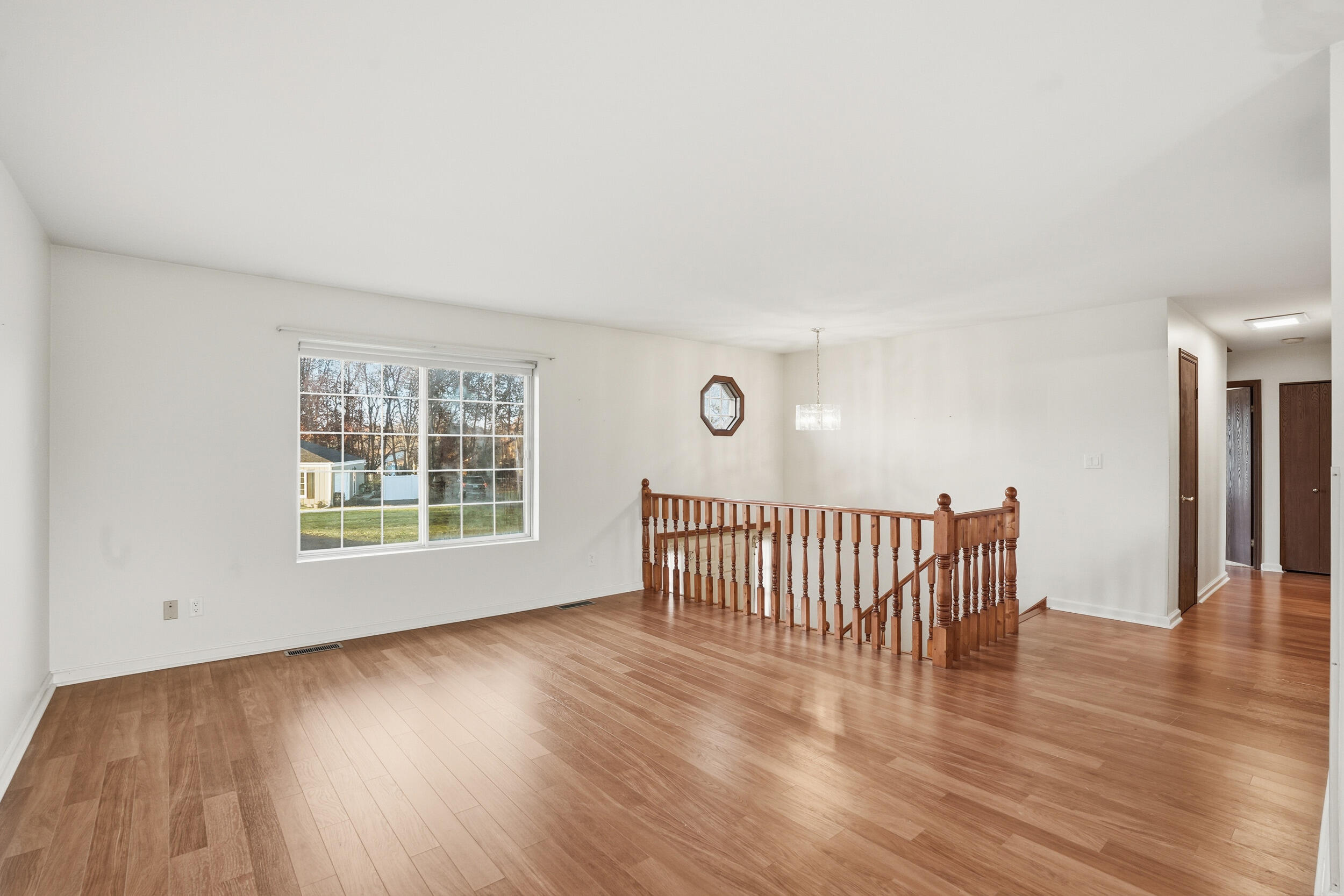4142 Augusta Drive Crown Point, IN 46307 - Photo 6 of 24 a view of a livingroom with wooden floor and a window