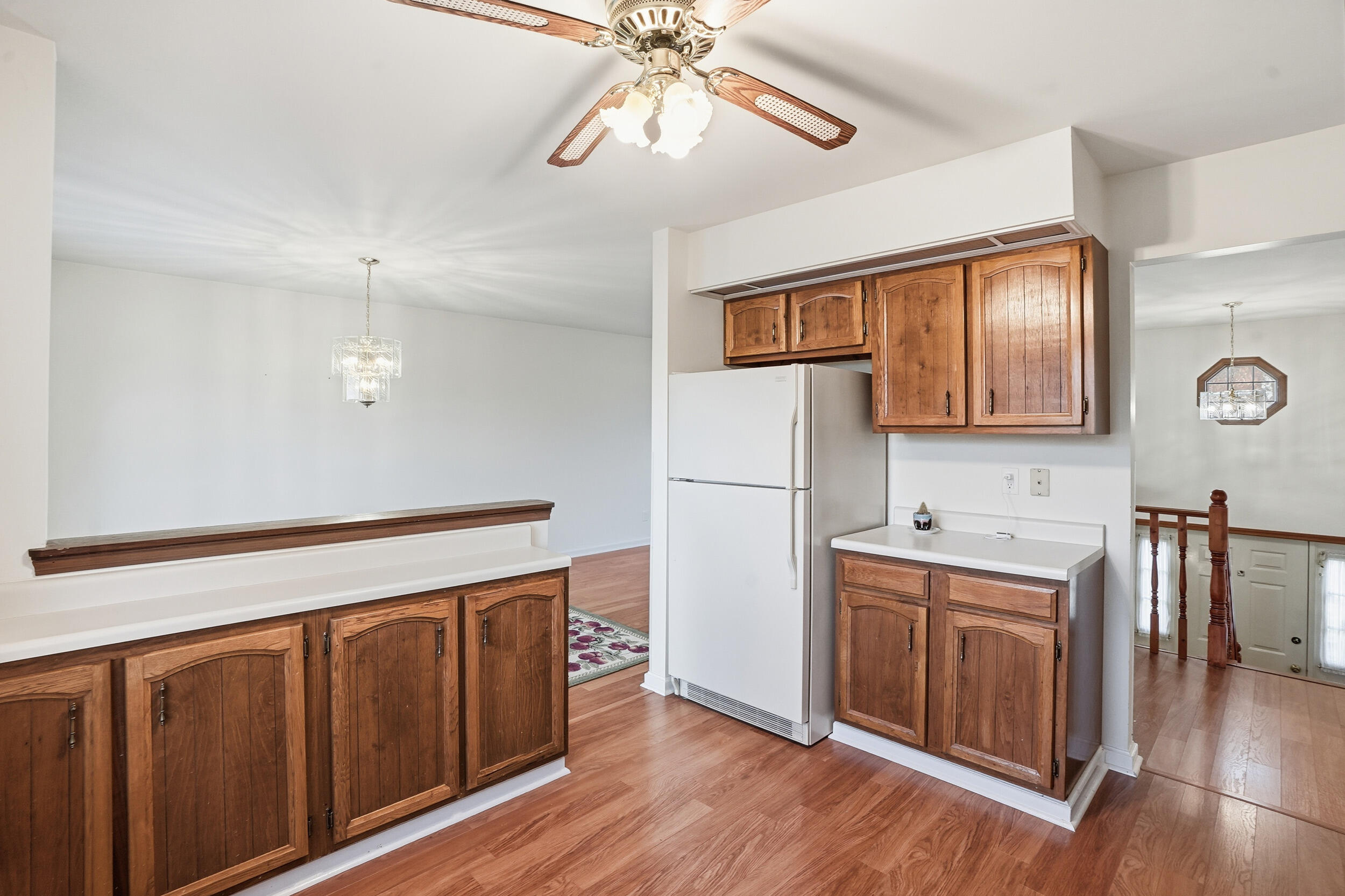 4142 Augusta Drive Crown Point, IN 46307 - Photo 9 of 24 a hallway with sink a mirror a washer and dryer