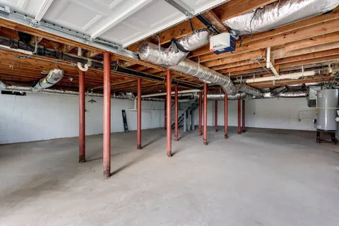 a view of an empty room with wooden roof