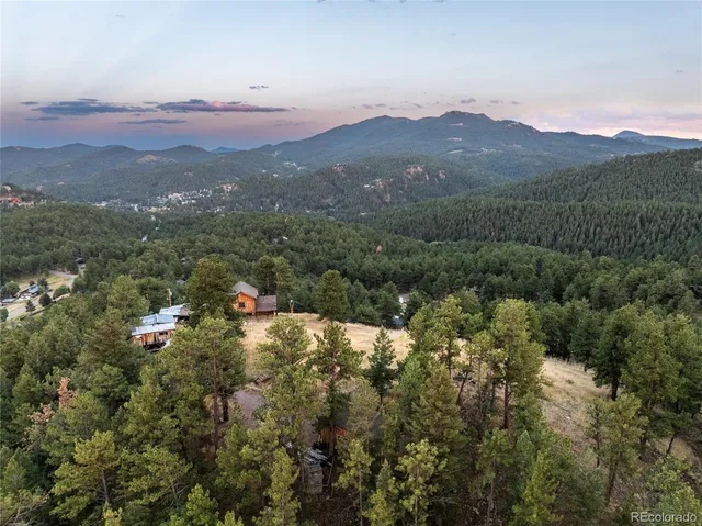 a view of a town with mountains in the background