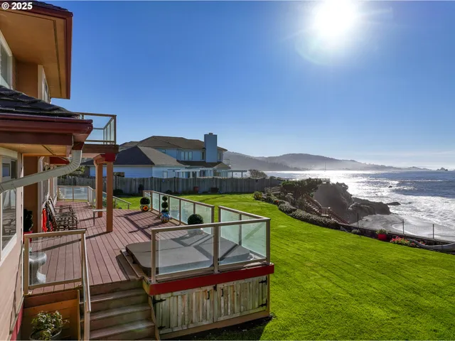 a view of a balcony with two chairs and a table