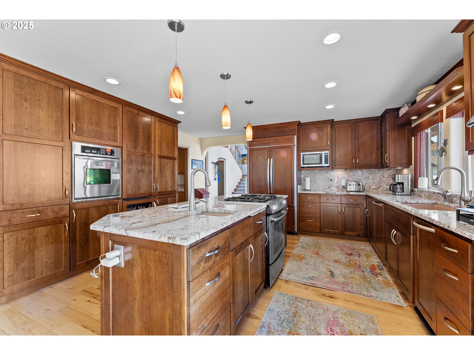 98686 Fox Drive Brookings, OR 97415 - Photo 20 of 48 a kitchen with stainless steel appliances granite countertop a sink a stove and a refrigerator