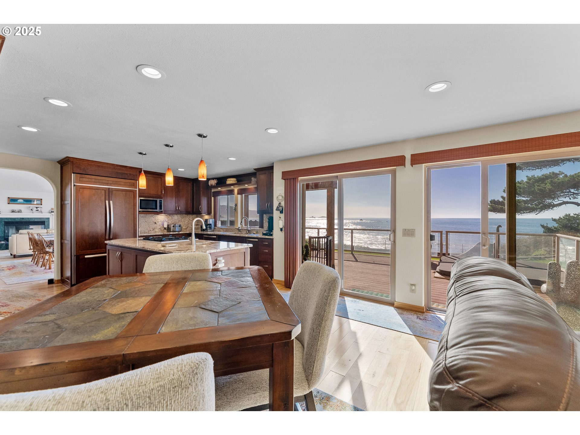 98686 Fox Drive Brookings, OR 97415 - Photo 22 of 48 a living room with stainless steel appliances kitchen island granite countertop furniture and a large window