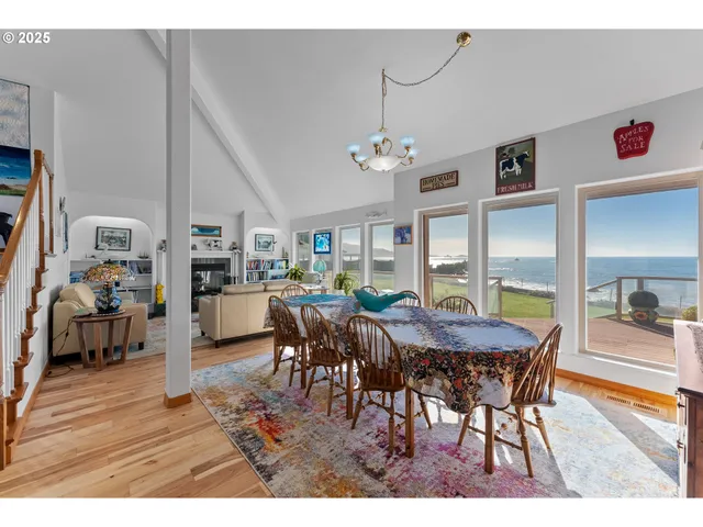 a dining room with furniture and a kitchen view