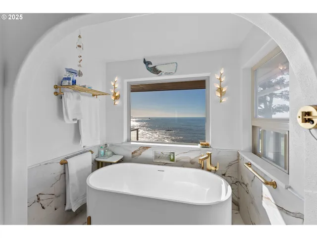 a bathroom with a bathtub and shower