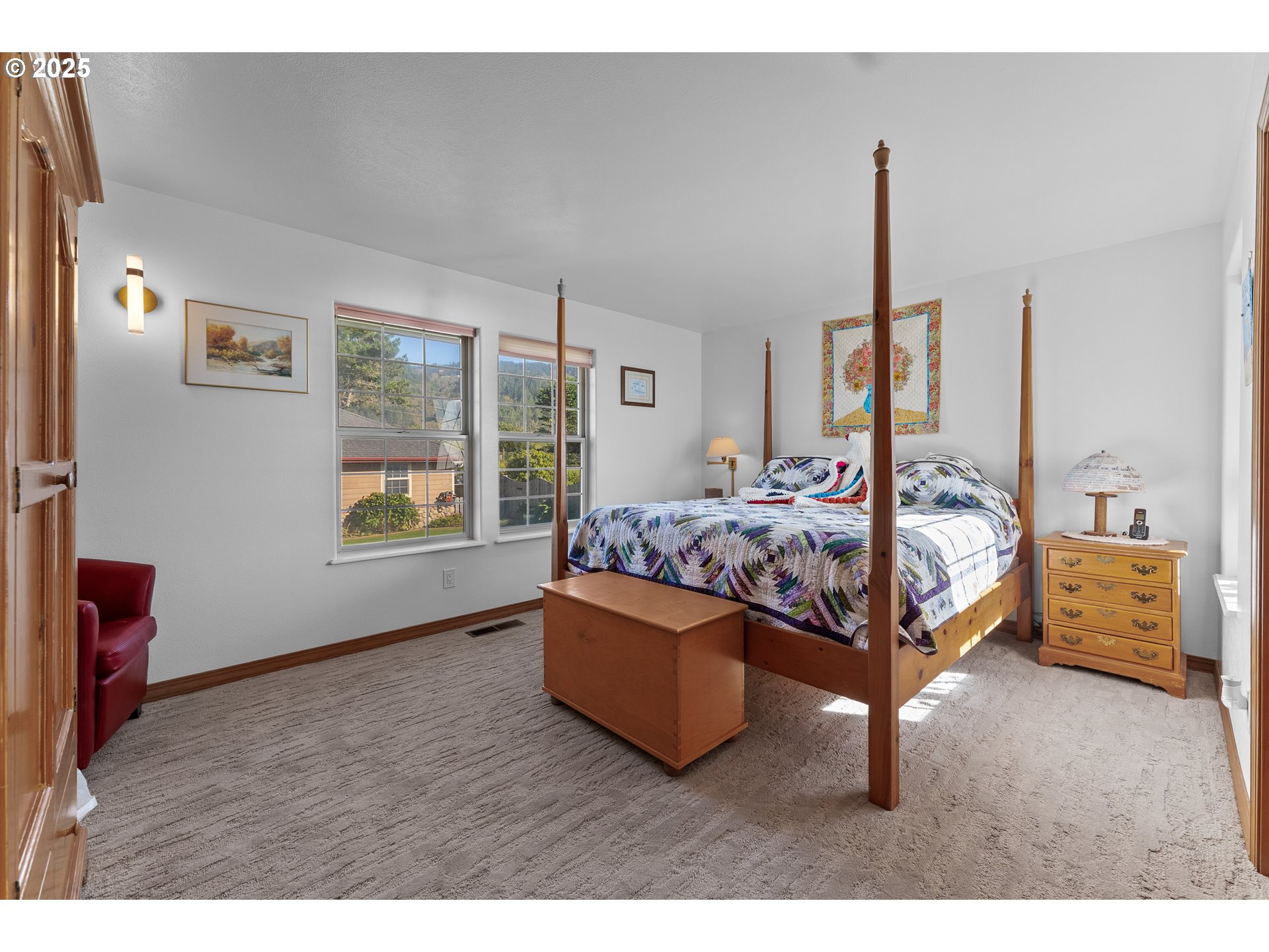 98686 Fox Drive Brookings, OR 97415 - Photo 33 of 48 a bedroom with a bed and window
