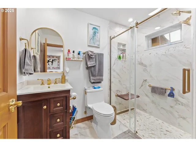 a bedroom with furniture and paintings on the wall