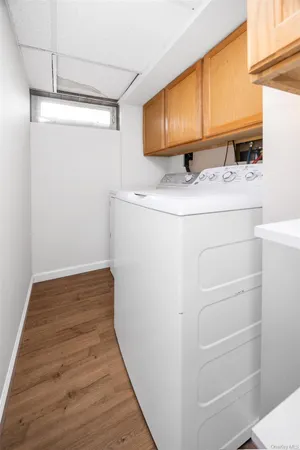 a view of storage and utility room with washer and dryer