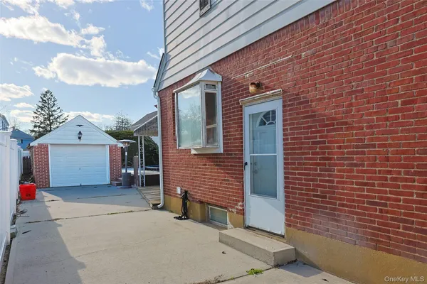 a view of a brick house with many windows