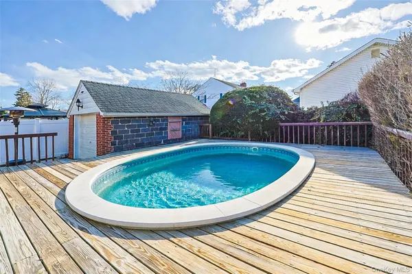 a view of a swimming pool with a patio