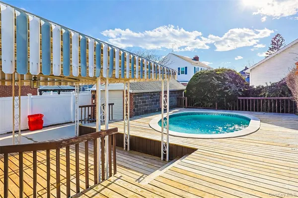 a balcony with table and chairs