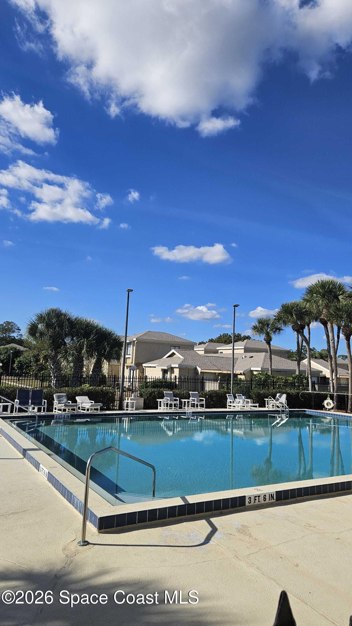 1491 Sheafe Avenue Northeast, Unit 104 Palm Bay, FL 32905 - Photo 17 of 19 a view of swimming pool with outdoor seating