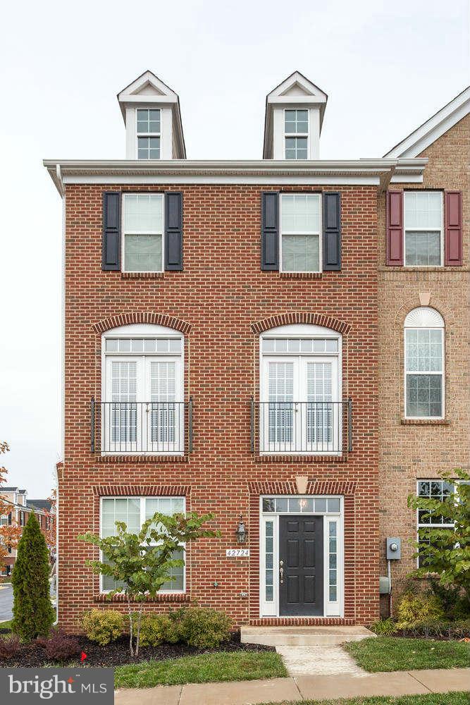 42724 Redpath Terrace Ashburn, VA 20147 - Photo 1 of 17 a front view of a house with a yard