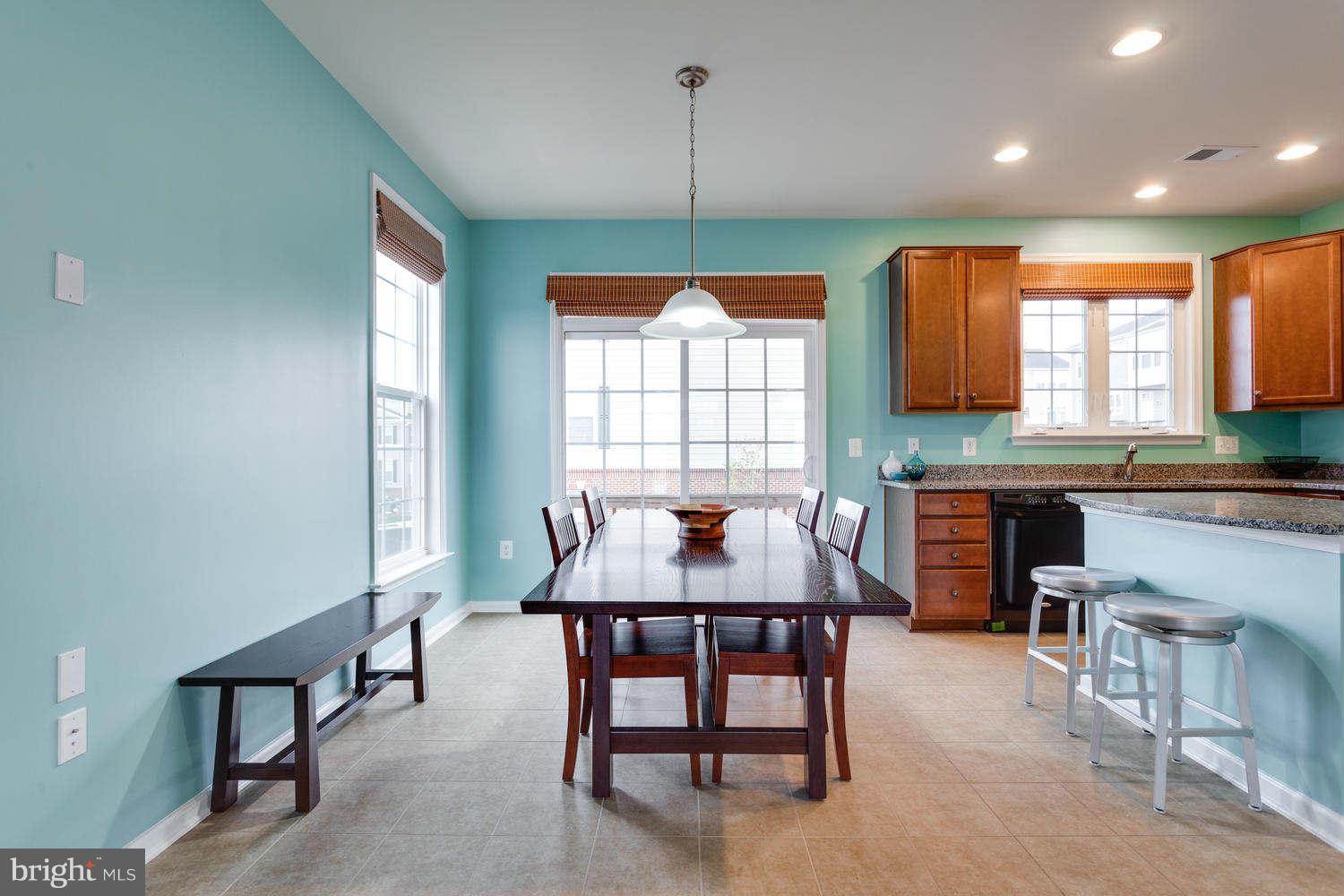42724 Redpath Terrace Ashburn, VA 20147 - Photo 3 of 17 a kitchen with a table chairs sink and window