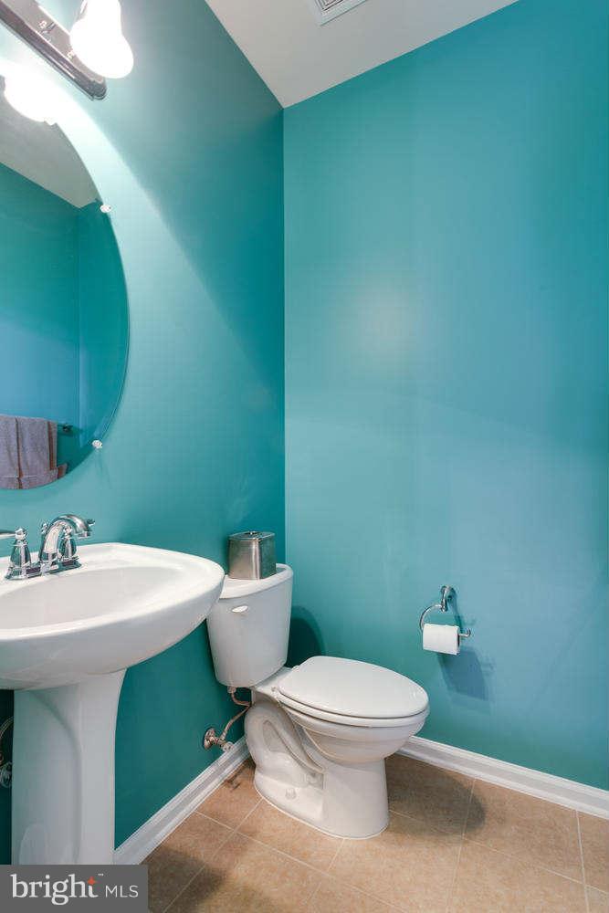 42724 Redpath Terrace Ashburn, VA 20147 - Photo 6 of 17 a white toilet sitting next to a bathroom sink