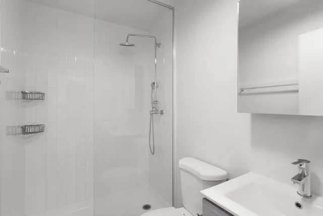 a bathroom with a sink and shower