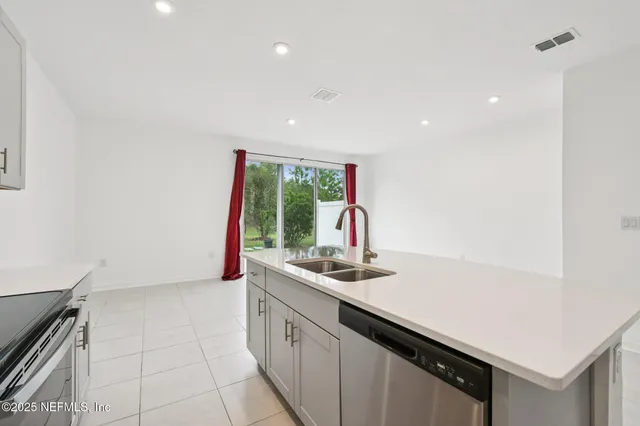 a kitchen with a sink and cabinets