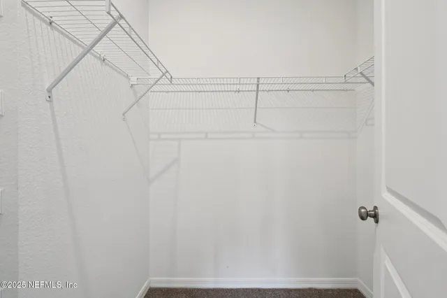 a view of small space with racks on the wall