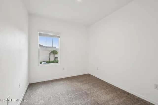 a view of a room that has a window in it