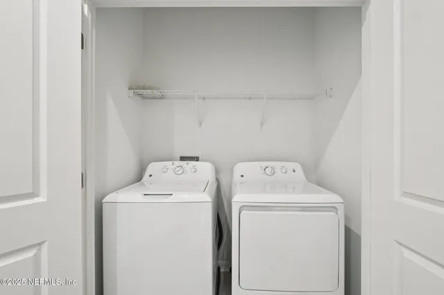 a utility room with dryer and washer