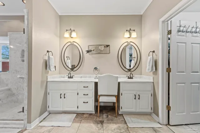 a view of bathroom with sink mirror and toilet