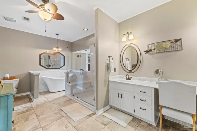 a bathroom with a granite countertop sink mirror and a shower