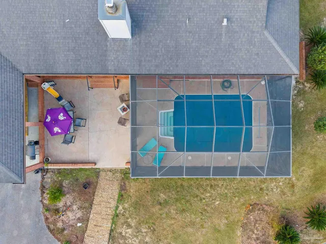 a view of a house with garden and sitting area