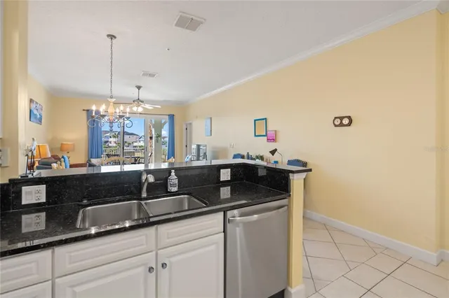 a view of a dining room with furniture wooden floor and chandelier