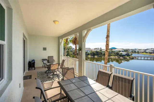 a view of a lake with houses in the back