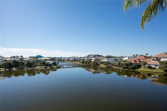 a kitchen with stainless steel appliances kitchen island granite countertop a table and chairs in it