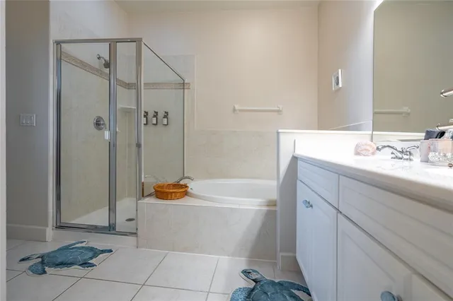 a bathroom with a double vanity sink mirror and toilet