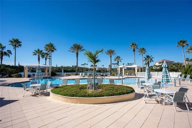 a view of a swimming pool with a lounge chairs