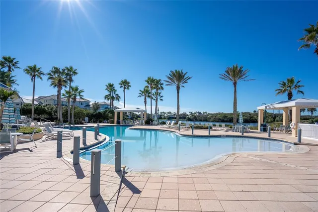 a view of a lake with outdoor seating space