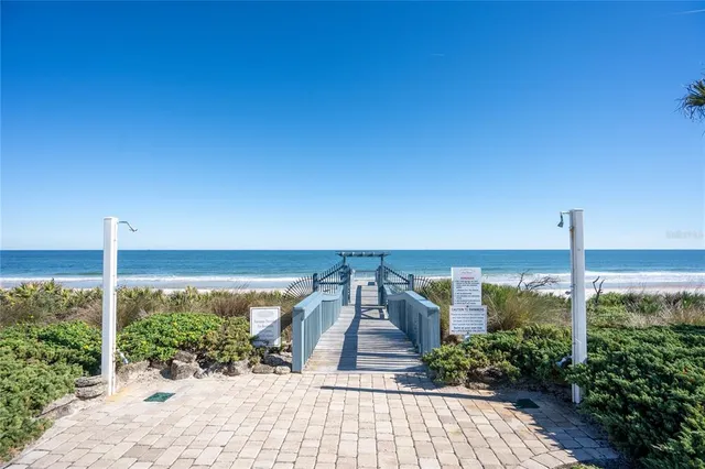 a view of swimming pool with sitting area