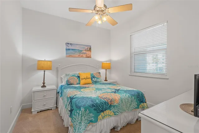 a bedroom with a bed and a television