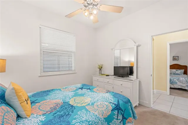 a bedroom with two beds and a table