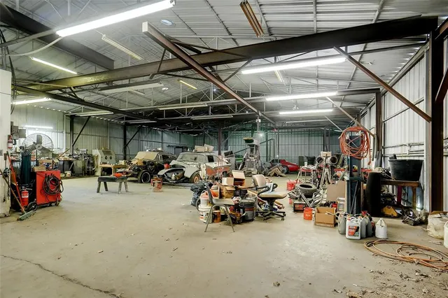 a view of a garage with a bike and car