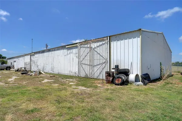 a view of a backyard of the house