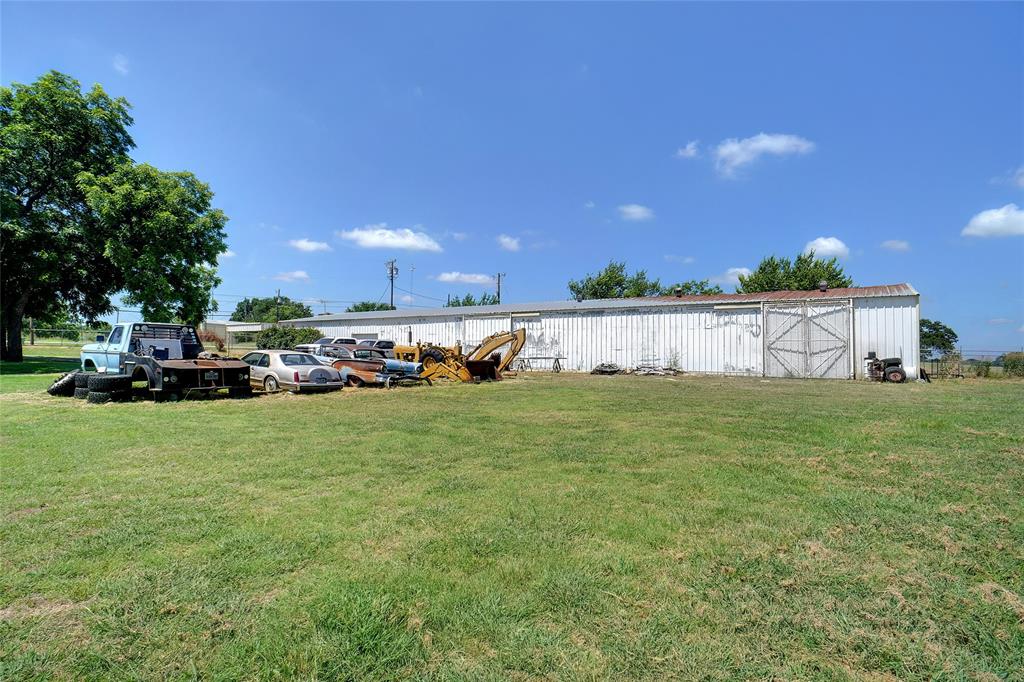 1092 West Highway 199 Springtown, TX 76082 - Photo 22 of 23 a view of a garden with houses