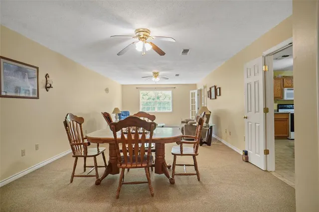 a view of a dining room with furniture