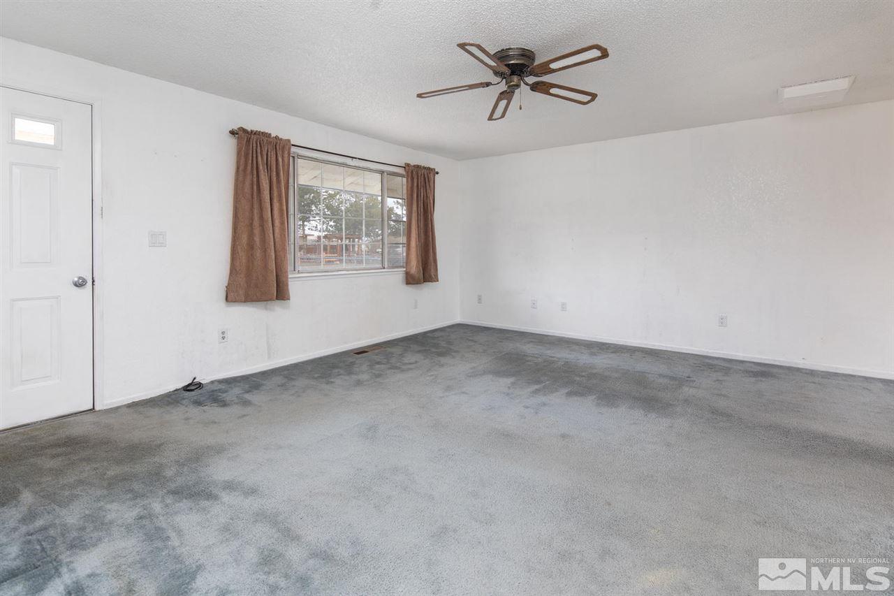 218 Ring Road Dayton, NV 89403 - Photo 3 of 25 an empty room with a window
