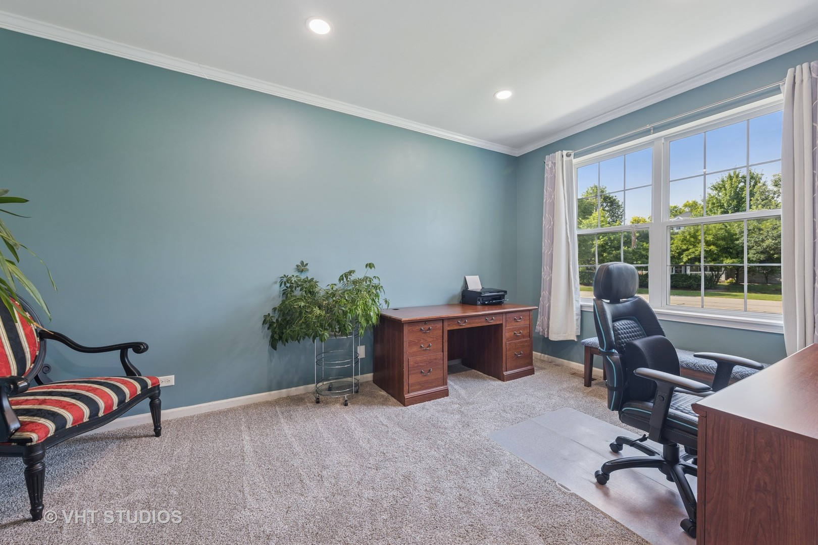 13733 Meadow Lane Plainfield, IL 60544 - Photo 11 of 39 a view of a workspace with furniture and a window