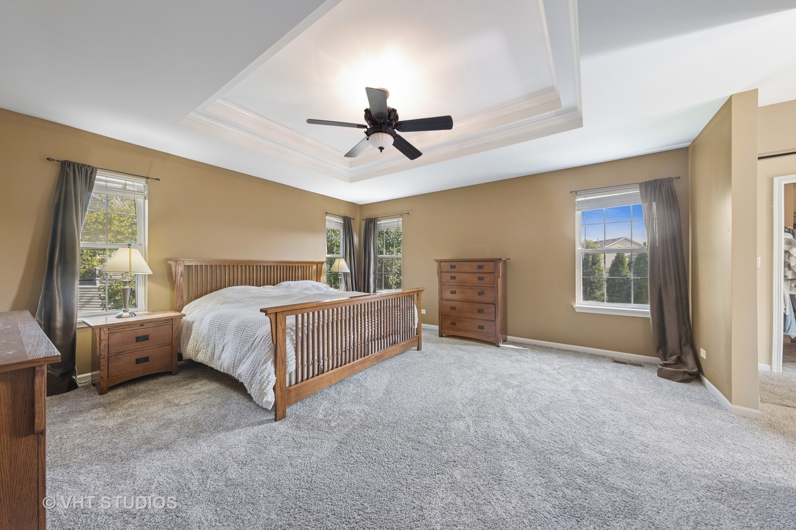 13733 Meadow Lane Plainfield, IL 60544 - Photo 15 of 39 a bed room with a bed and a ceiling fan