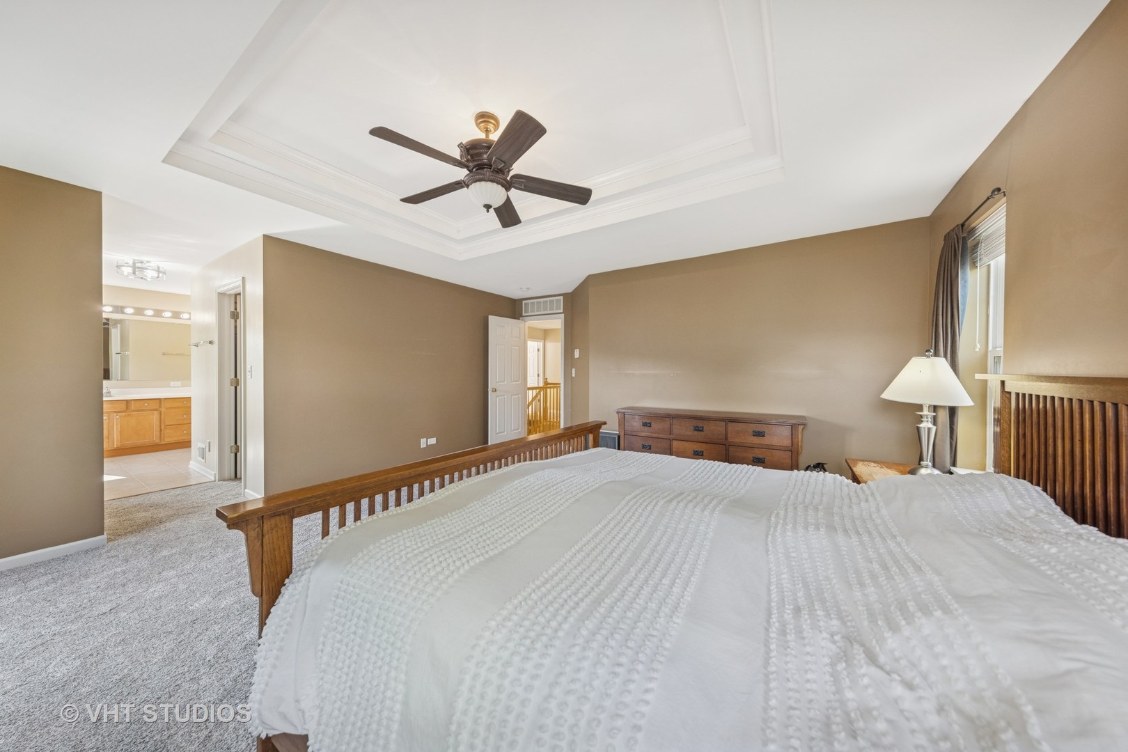 13733 Meadow Lane Plainfield, IL 60544 - Photo 16 of 39 a bedroom with a bed and a chandelier