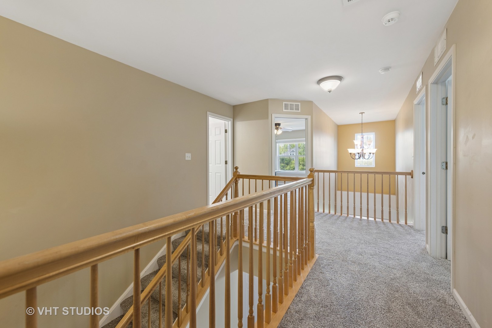13733 Meadow Lane Plainfield, IL 60544 - Photo 22 of 39 a view of a hallway with wooden floor and windows