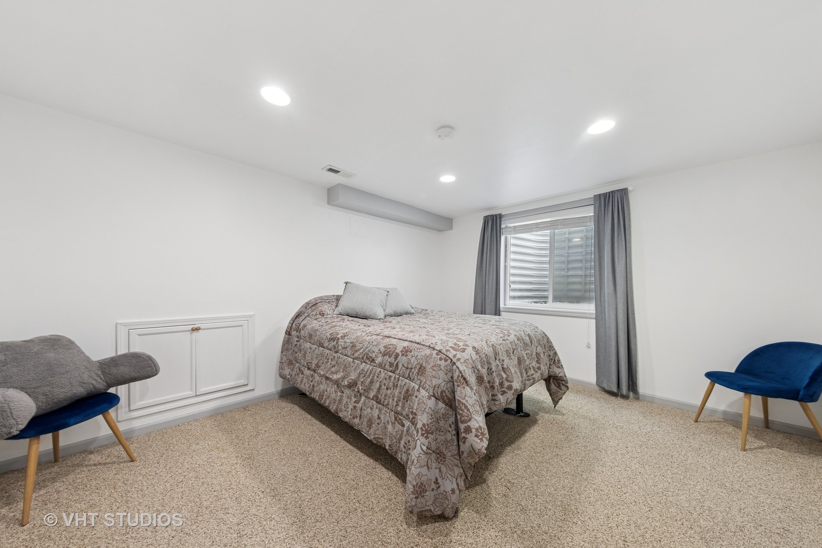 13733 Meadow Lane Plainfield, IL 60544 - Photo 27 of 39 a spacious bedroom with a bed and a chair