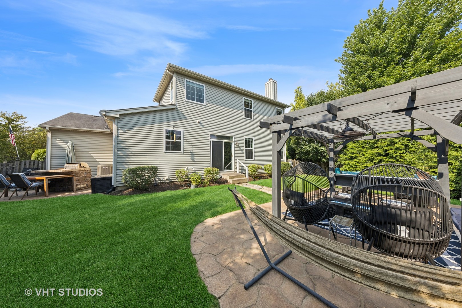 13733 Meadow Lane Plainfield, IL 60544 - Photo 34 of 39 a view of a porch with furniture and garden