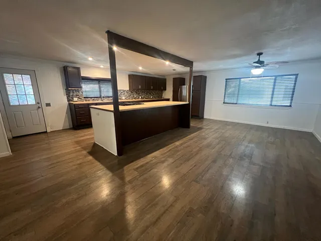 a kitchen with a sink and cabinets